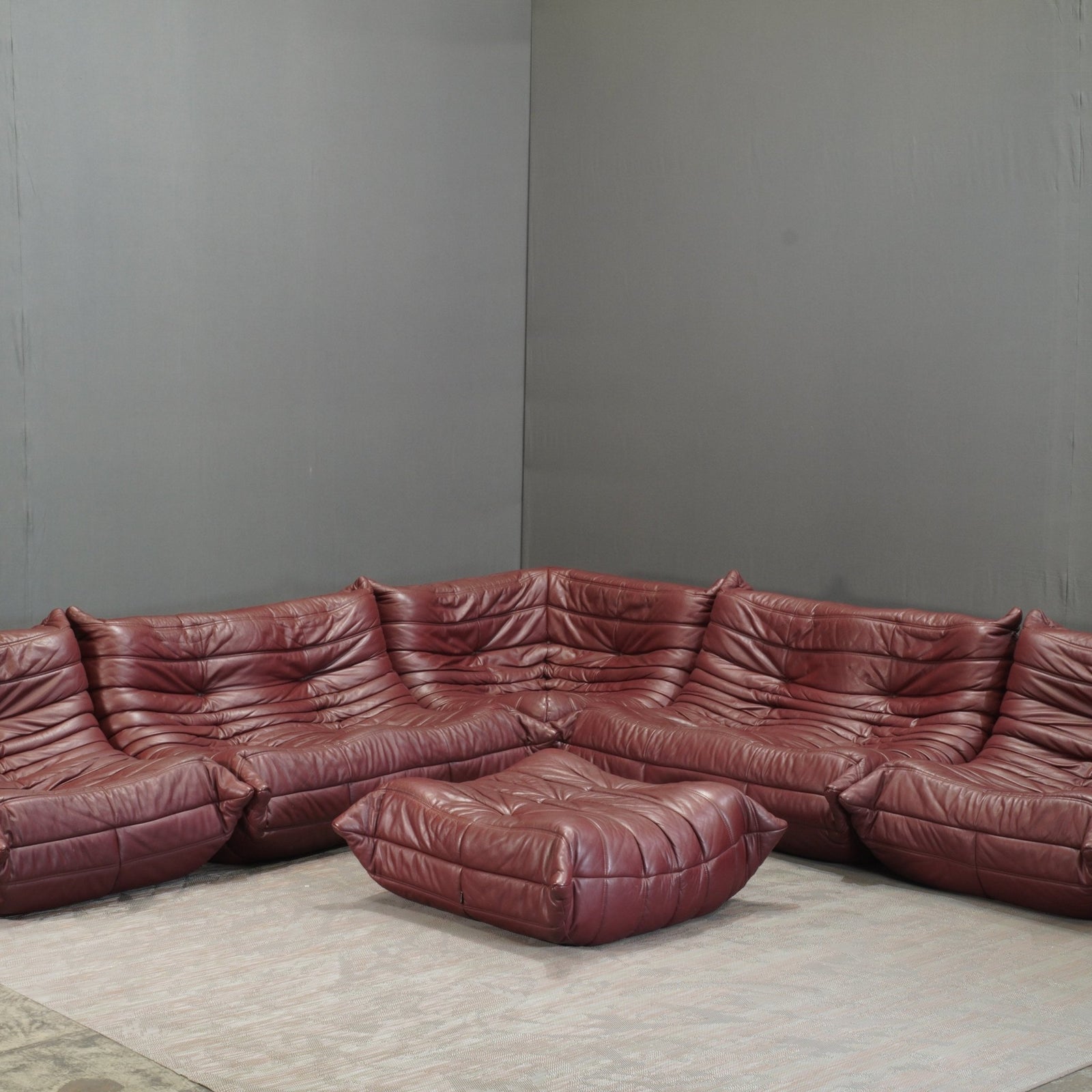 Ligne Roset Burgundy Leather Modular Sofas and Footstool, by Michel Ducaroy, Set of Six @ REHAUS