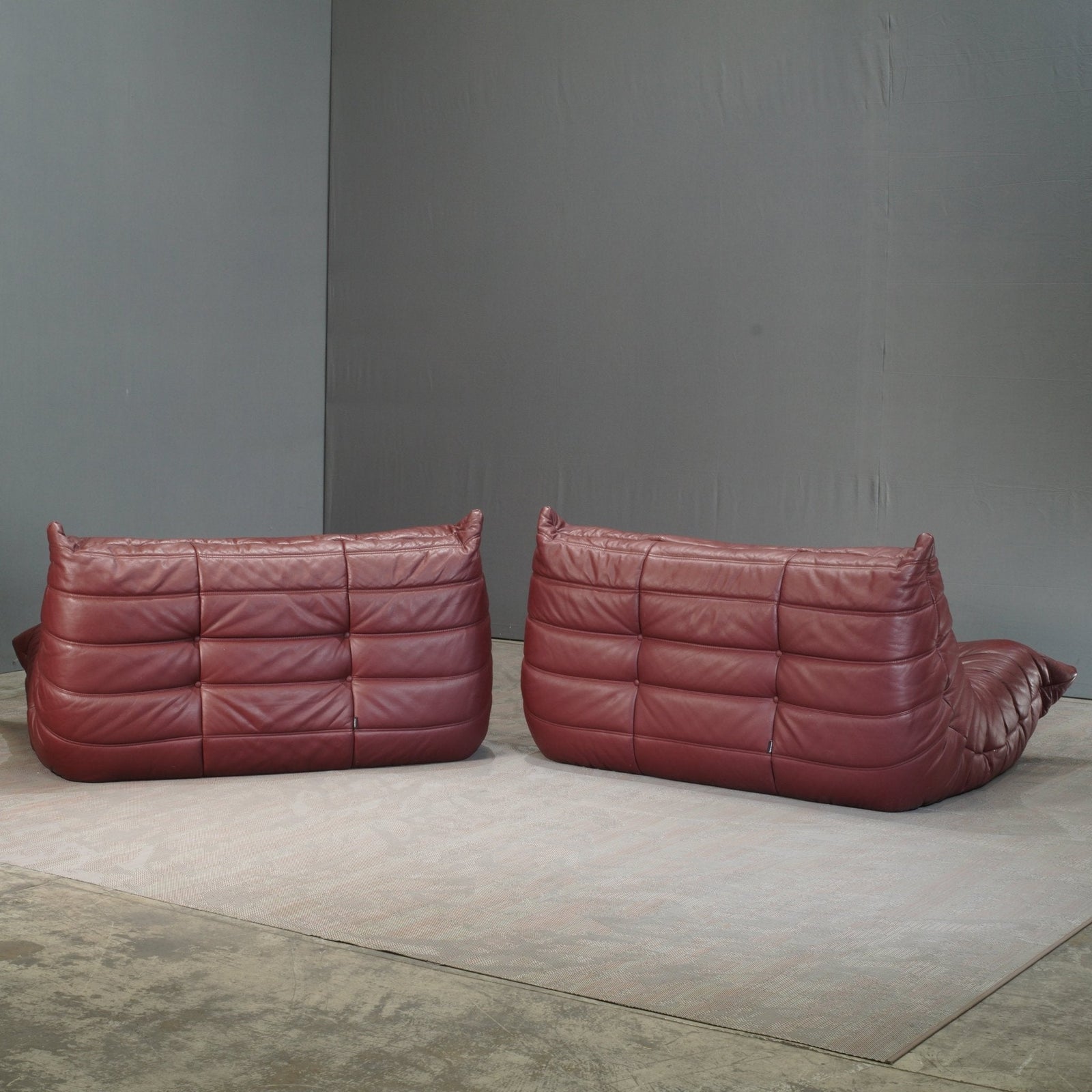 Ligne Roset Burgundy Leather Modular Sofas and Footstool, by Michel Ducaroy, Set of Six @ REHAUS