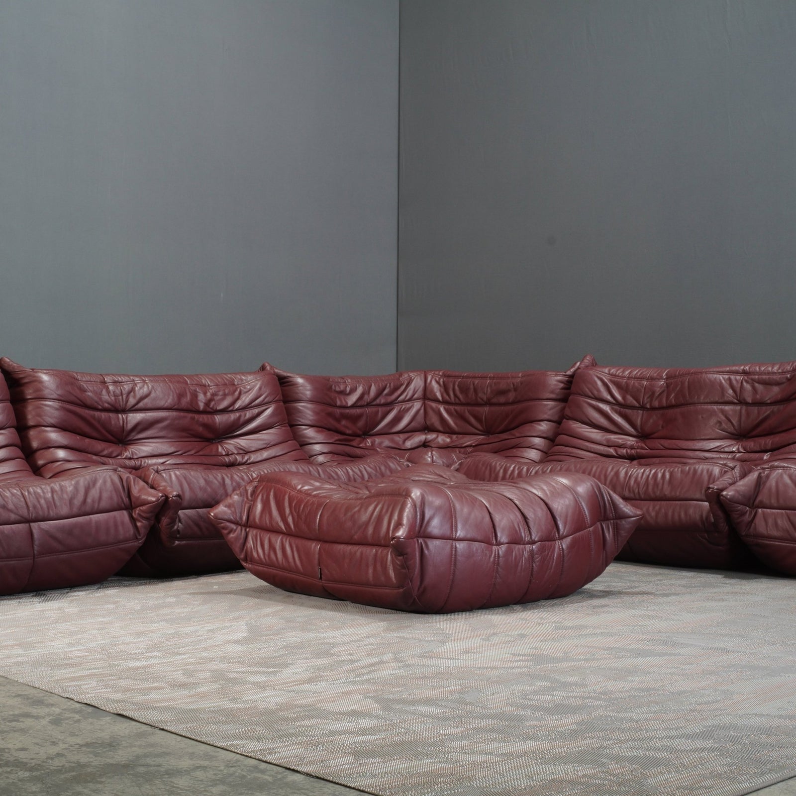 Ligne Roset Burgundy Leather Modular Sofas and Footstool, by Michel Ducaroy, Set of Six @ REHAUS