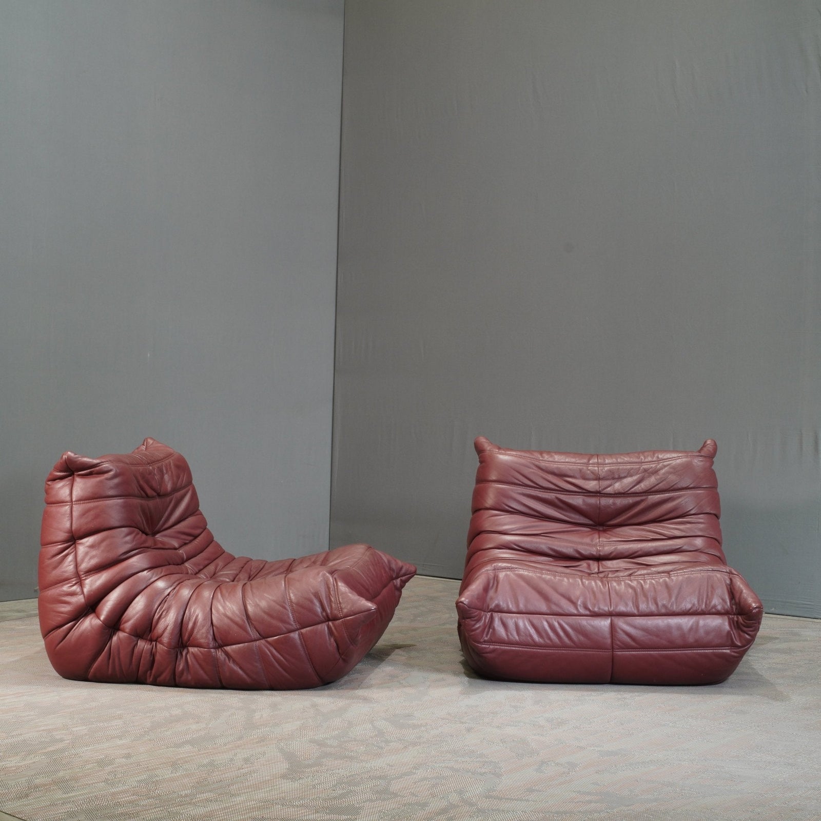 Ligne Roset Burgundy Leather Modular Sofas and Footstool, by Michel Ducaroy, Set of Six @ REHAUS