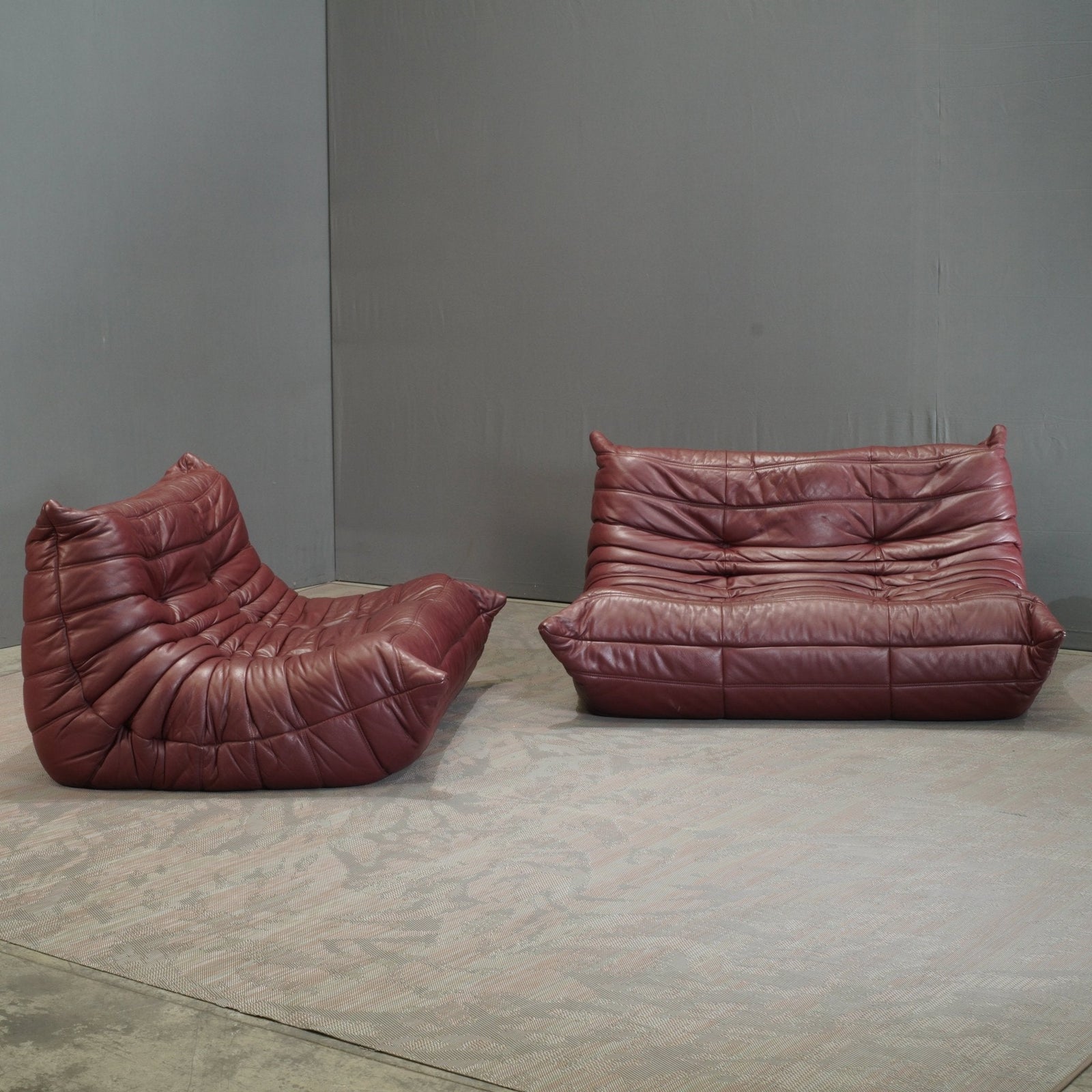 Ligne Roset Burgundy Leather Modular Sofas and Footstool, by Michel Ducaroy, Set of Six @ REHAUS