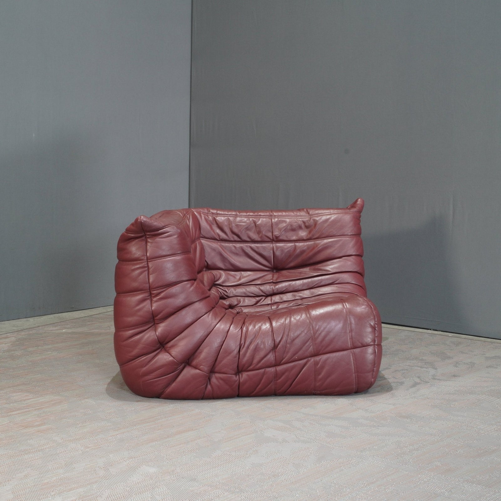 Ligne Roset Burgundy Leather Modular Sofas and Footstool, by Michel Ducaroy, Set of Six @ REHAUS