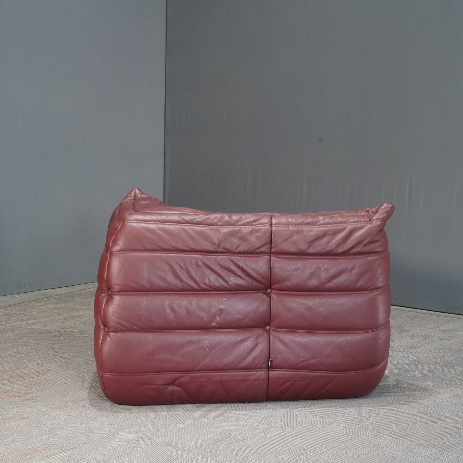 Ligne Roset Burgundy Leather Modular Sofas and Footstool, by Michel Ducaroy, Set of Six @ REHAUS