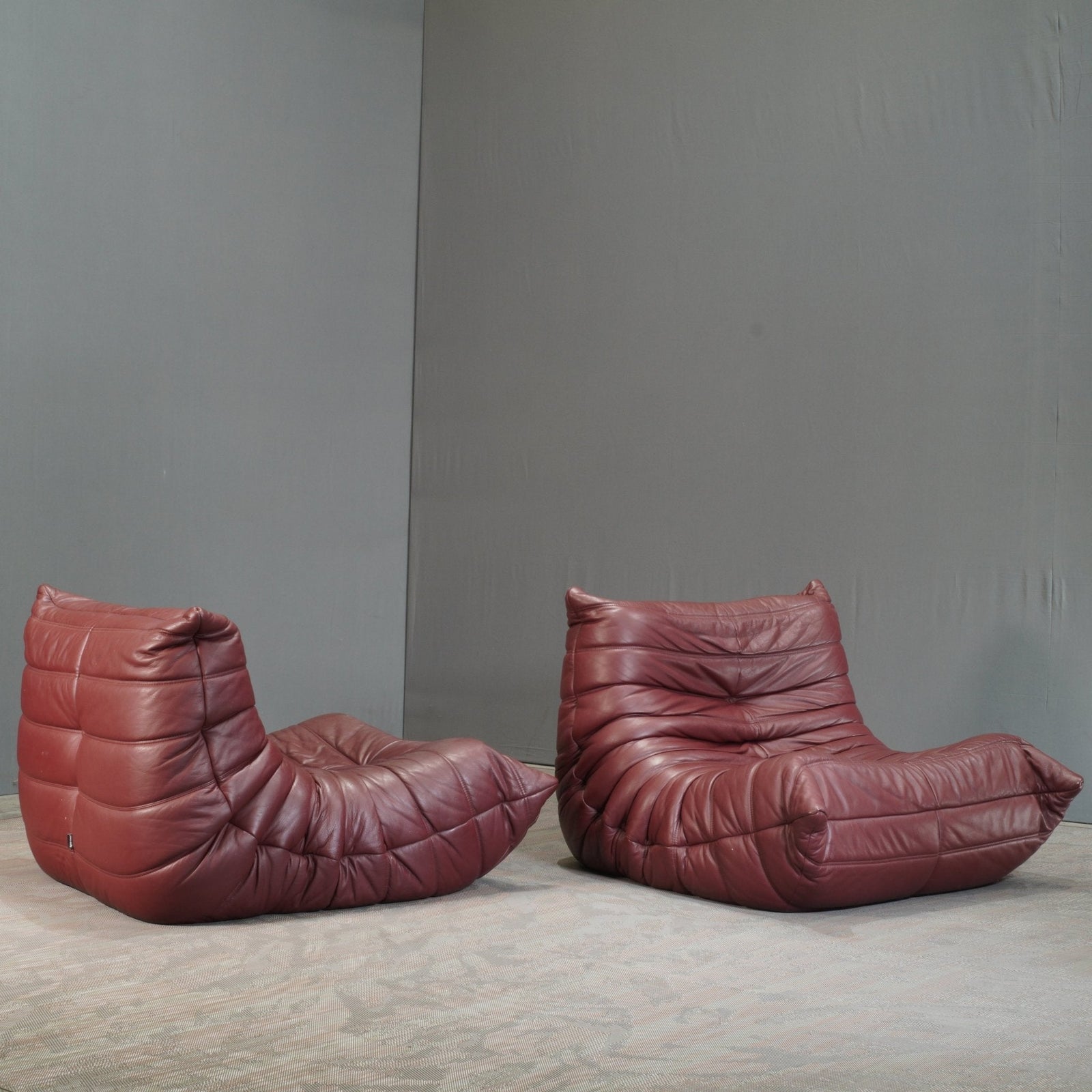 Ligne Roset Burgundy Leather Modular Sofas and Footstool, by Michel Ducaroy, Set of Six @ REHAUS