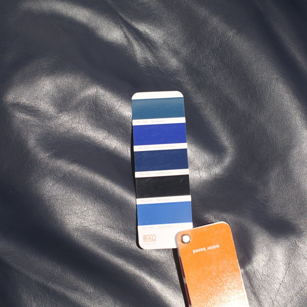 SCP Balzac Blue Leather Armchair and Footstool @ REHAUS